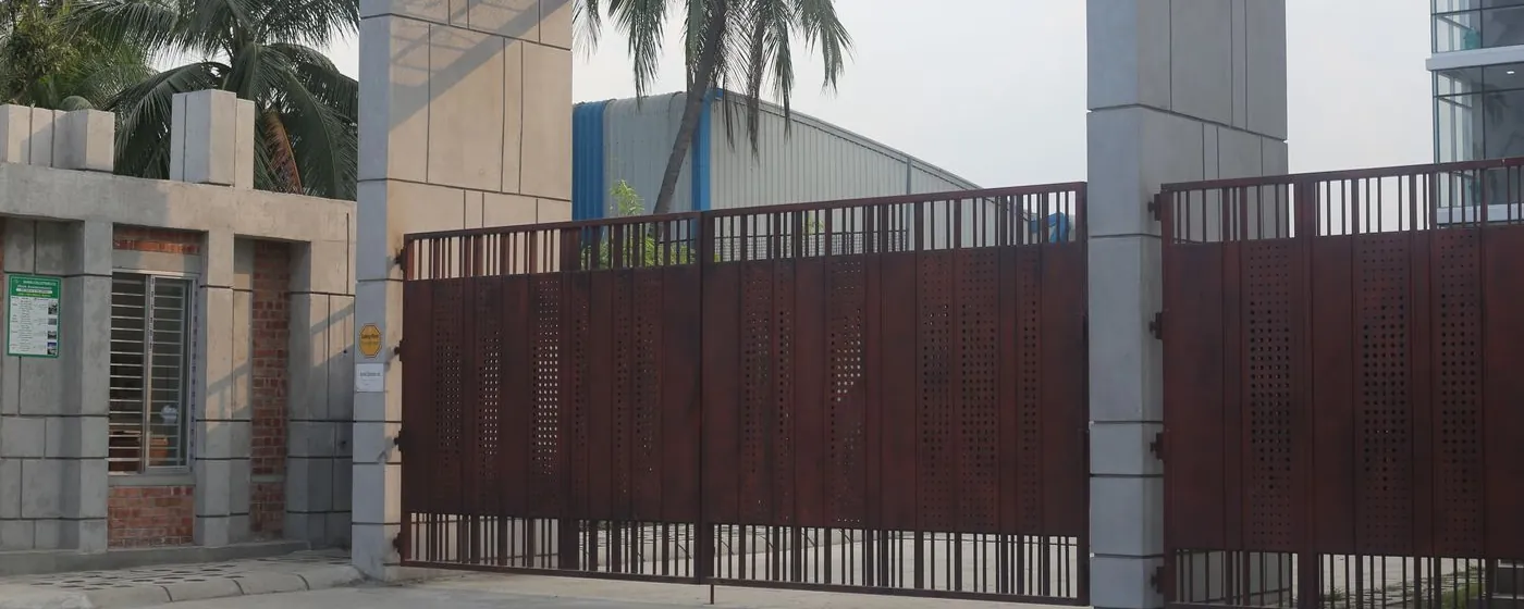 Stock photo: a closed automated entrance gate with palm trees