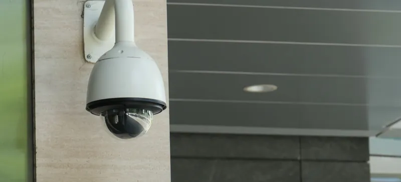 Stock photo: a CCTV camera mounted on a building wall